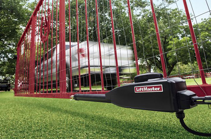 LiftMaster swing gate operator in action, with the gate open and a car passing through, demonstrating the efficiency and reliability of Access Systems.