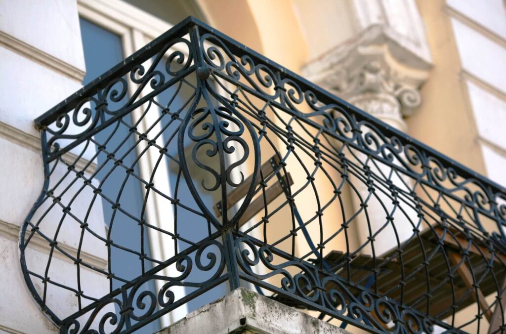 Close-up view of a beautifully crafted metal fabricated and welded decorative balcony, showcasing Greenlogic's expertise in metalwork.