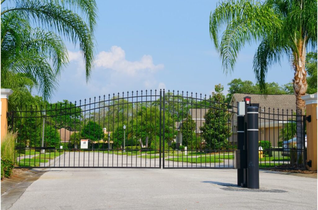 A beautifully crafted metal entrance gate to a residential multifamily community complex, showcasing Greenlogic's expertise in metal fabrication and welding services.