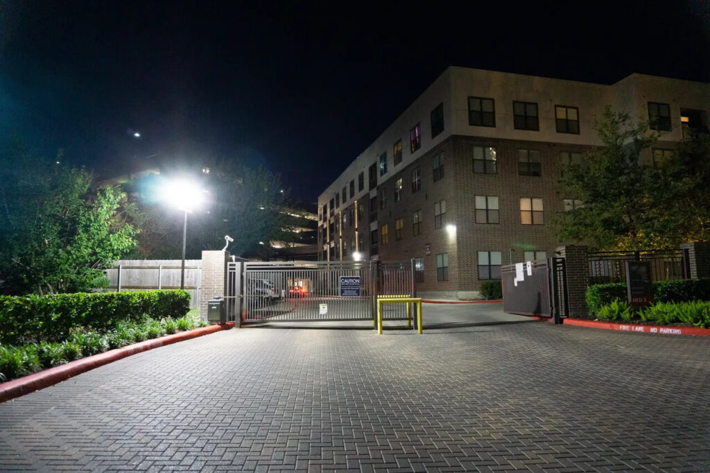 Safe and well-lit entrance of a MUDs complex, demonstrating the transformation brought by property management LED lighting.